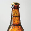 A detailed close-up image of the top of a glass brown beer bottle, isolated on a clean white background.