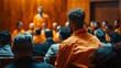 © Антон Сальников - Defendant in orange jumpsuit is questioned and giving evidence before the judge and jury. Criminal denies charges, pleadings. Inmate denied parole.
