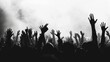 © Sergey - Silhouettes of people with hands raised in a crowd, possibly at a concert or gathering, monochrome image.