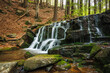 Waterfall on the Hucava stream in forest and mountains of Jeseniky, Czech Republic. Beautiful tranquil scenery in nature