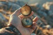 © Fotograf - A person holding a compass for direction finding. Suitable for travel and exploration concepts