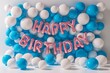 Happy Birthday Celebration with Vibrant Blue and White Balloons and Pink Lettering.