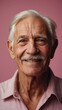 © Sahaidachnyi Roman - Gray-haired elderly man in stylish club clothes on a pink background.