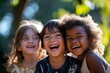 © Nuttakarn - Joyful Children Laughing Together Outdoors