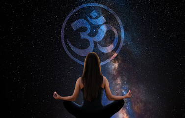 Wall Mural - Woman meditating with the universe in the background with buddhist Om sign 