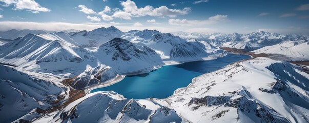 panoramic aerial view of snowy mountains with a blue lake in the middle Generative AI