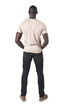 back  view of a man with hands in front pockets on white background