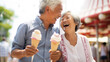 Joyful laughing Senior Asian Couple Enjoying Ice Cream at Summer Amusement Park