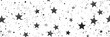 Seamless pattern of small detailed stars scattered on a white background