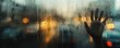 © cac_tus - Hand pressing against a rainy window with blurred street lights