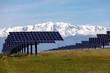 © ADDICTIVE STOCK - Solar Panels in Front of Snowy Mountain Range