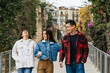 © ADDICTIVE STOCK - Friends enjoying a leisurely walk outdoors
