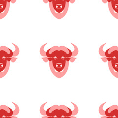 Wall Mural - Seamless pattern of large isolated red buffalo head symbols. The elements are evenly spaced. Illustration on light red background