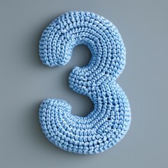 Wall Mural - A knitted number 3 in blue color on the gray background.