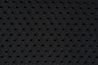 Black fabric texture with holes