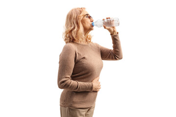 Sticker - Middle aged woman drinking water from a plastic bottle