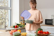 © Pixel-Shot - Beautiful young woman with vegetables for freezing in kitchen