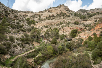 Wall Mural - hiking trail caminito del rey, kings walkway, in Malaga Spain. narrow footpath leads through natural beauty mountain range cliff faces of gaitanes gorge. hisotric landmark popular tourist attraction