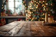 © Elmira - A wooden table is positioned in front of a beautifully decorated Christmas tree