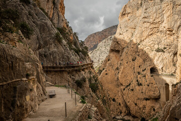 Wall Mural - hiking trail caminito del rey, kings walkway, in Malaga Spain. narrow footpath leads through natural beauty mountain range cliff faces of gaitanes gorge. hisotric landmark popular tourist attraction