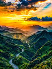 Canvas Print - The sun is setting over the mountains with winding road in the foreground.