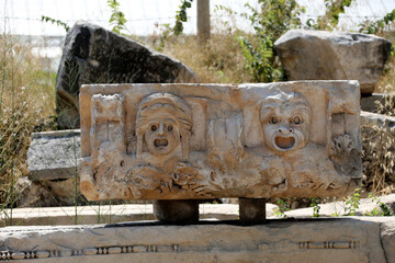 Wall Mural - Stone faces bas relief at Myra ancient city. Demre, Turkey
