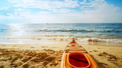 Orange kayak on a sandy beach facing the sea. Sea kayak ready for adventure. Concept of adventure travel, summer vacation, beach activities, and ocean exploration