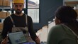 © DC Studio - Fulfillment center employee carrying out the logistics of receiving, processing, storing and sending inventory according to purchase orders and shipping schedules, helped by knowledgeable colleague