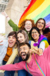 © Xavier Lorenzo - Happy gay group of young people celebrating gay pride day festival. LGBT community concept