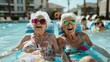 Two elderly women wearing goggles, laughing and relaxing in a pool

