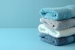 Stack of Towels on Blue Background