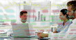 Image of trading board and graphs over diverse coworkers discussing reports in office