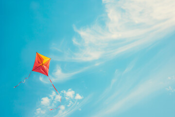wind kite flying over a blue sky with copy space, representing freedom and journey concept, ideal wa