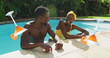 Image of drink icons over african american couple at pool