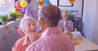 Image of heart icons over diverse senior friends dancing