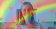 Image of heart emojis and rainbow flag over caucasian woman smiling