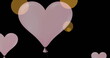 Image of pink heart balloons icons floating against copy space on black background
