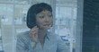 Image of stock market data processing over asian woman talking on phone headset at office
