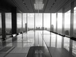 A modern conference room with a long table, chairs, and panoramic city views, photographed in grayscale, symbolizing corporate success. Generative AI