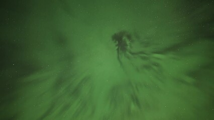 Wall Mural - An enchanting spectacle of the colorful northern lights in the dark sky. A timelapse video.