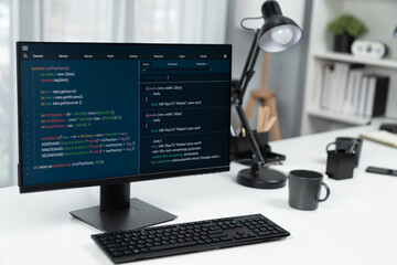 programming code on computer screen desktop placing on working desk showing intelligent website deve