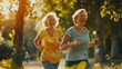 Two cheerful smiling elderly women of 60 years old are running through the park on a sunny summer day. The concept of an active