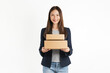 Smiling beautiful Asian businesswoman holding cardboard boxes on white background. Concept delivery online.