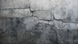 An expansive, jagged gap fractures the surface of a sturdy gray concrete wall, leaving behind a visual testament to the forces of impact, erosion, or deliberate rupture.