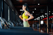Young Asian Woman Running on Treadmill - Fitness Gym Exercise