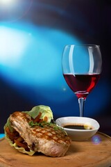 Wall Mural - Red wine with tasty grilled meat in Restaurant