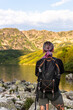 Adventure woman hiker on trial in Tatra Mountains in Poland. Back view.