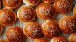 Crisp, clear top-down shot of classic sesame seed buns, showcasing their traditional, soft texture and sesame seed topping, ideal for advertising