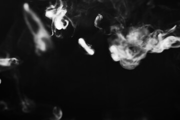 Wall Mural - White smoke over black background for overlay design