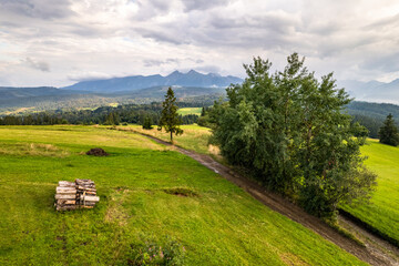 Wall Mural - Countryside fields and scenic landscape in Podhale region of Poland. Aerial drone view.